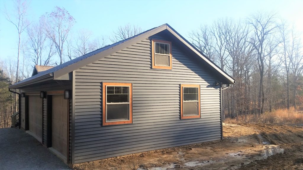 A side view of the outside of a house we built. You can see the garage.