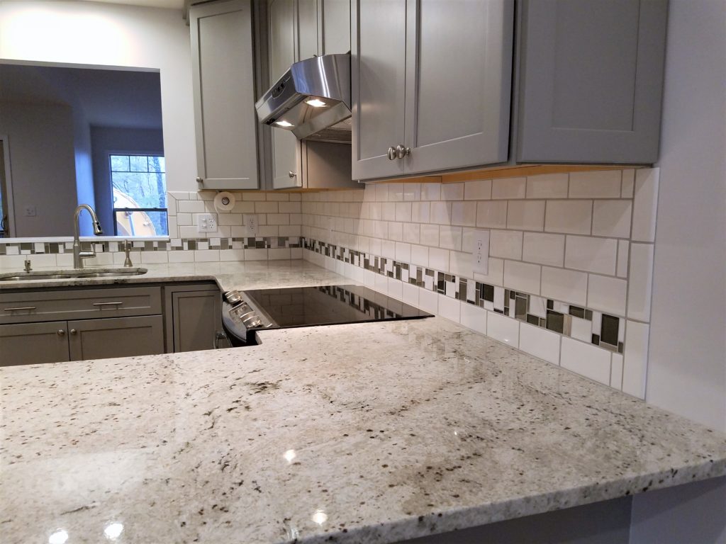 A view of the kitchen tile work on the walls.