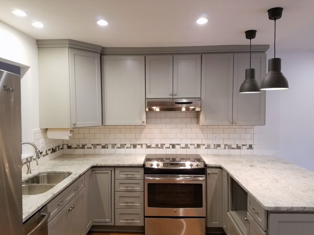 A second view of the kitchen, cabinets, and countertop