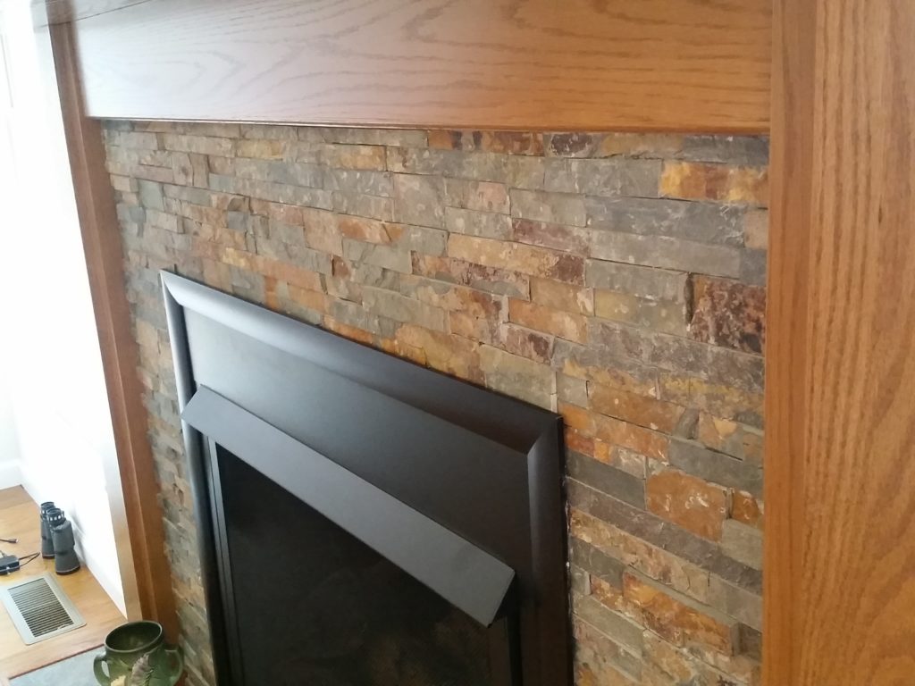 A close-up view of the stone work of the fireplace.
