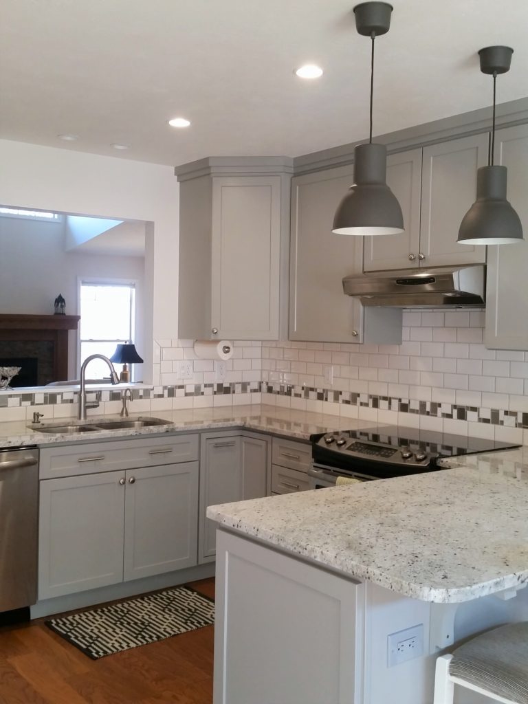 A third view of the kitchen, cabinets, and countertop