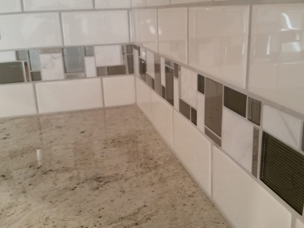 A close-up view of the tile of the kitchen back splash.