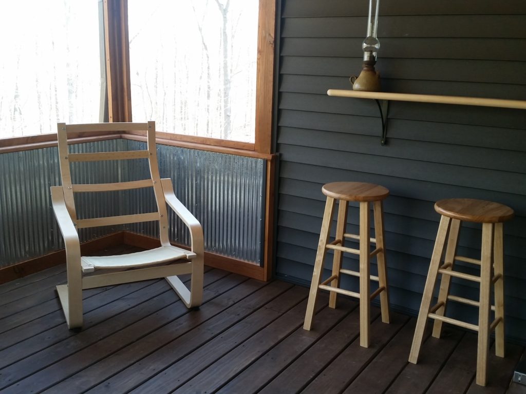 A view of another corner of the inside of the screened-in porch.